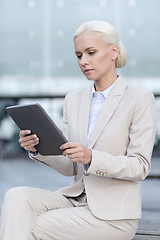 Image showing businesswoman working with tablet pc outdoors