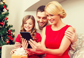 Image showing smiling family with tablet pc