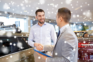 Image showing happy man shaking hands in auto show or salon