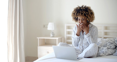 Image showing Young Woman Using Laptop On Bed