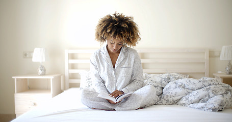 Image showing Woman Reading A Book On Bed