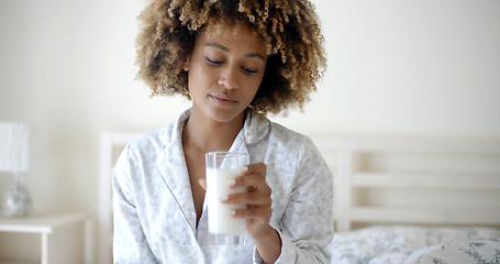 Image showing Woman Drinking A Milk On Bed