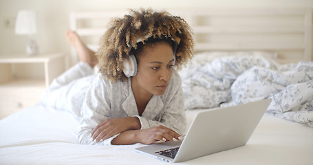 Image showing Woman Using Her Laptop In Bed