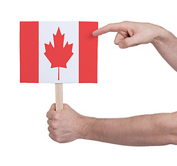 Image showing Hand holding small card - Flag of Canada