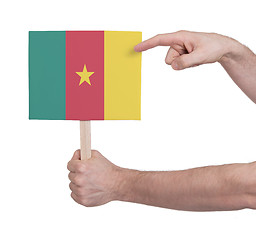 Image showing Hand holding small card - Flag of Cameroon