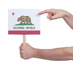 Image showing Hand holding small card - Flag of California