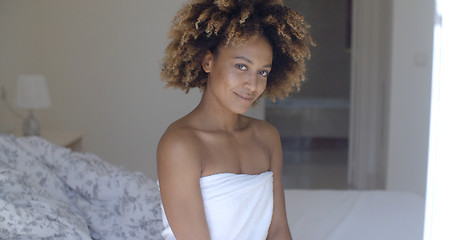 Image showing Happy Woman Sits In Bed And Smiling