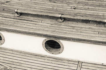 Image showing Close up of a deck of old sailing ship, sepia