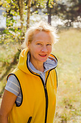 Image showing Portrait of a middle-aged woman in a park on a sunny day