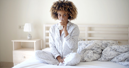 Image showing Woman Drinking A Milk On Bed