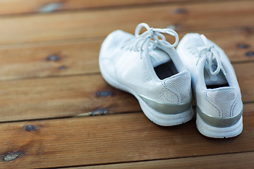 Image showing close up of sneakers on wooden floor