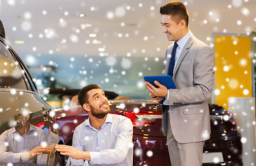 Image showing happy man with car dealer in auto show or salon