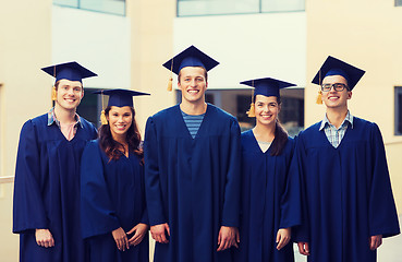 Image showing group of smiling students in mortarboards