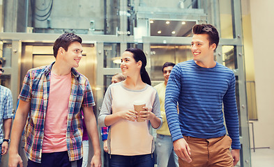 Image showing group of smiling students with paper coffee cups