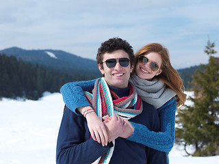 Image showing happy young couple having fun on fresh show on winter vacation