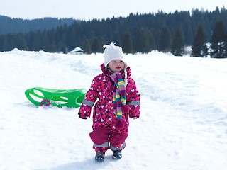 Image showing little baby girl have fun on fresh snow