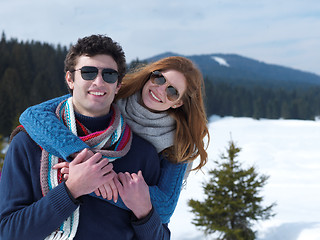 Image showing happy young couple having fun on fresh show on winter vacation