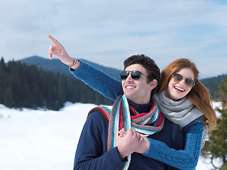 Image showing happy young couple having fun on fresh show on winter vacation