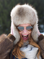 Image showing portrait of beautiful young redhair woman in snow scenery