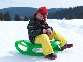 Image showing happy young boy have fun on winter vacatioin on fresh snow