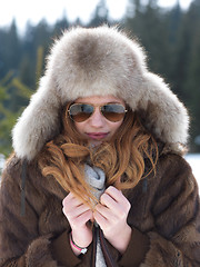 Image showing portrait of beautiful young redhair woman in snow scenery