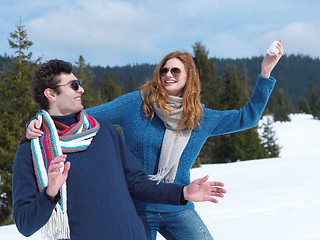 Image showing happy young couple having fun on fresh show on winter vacation