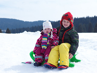 Image showing portrait of boy and baby girl on winter vacation