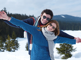 Image showing happy young couple having fun on fresh show on winter vacation