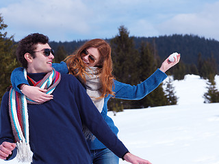 Image showing happy young couple having fun on fresh show on winter vacation