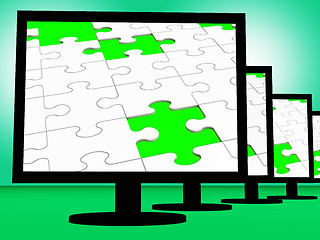 Image showing Unfinished Puzzle On Monitors Shows Missing Pieces