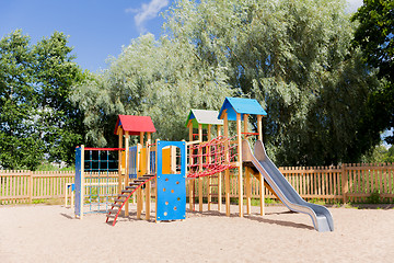 Image showing climbing frame with slide on playground at summer