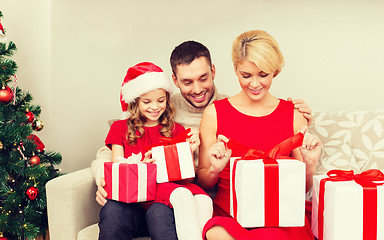 Image showing happy family opening gift boxes