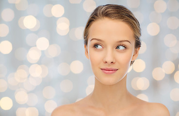 Image showing smiling young woman face and shoulders