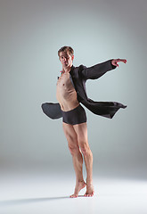 Image showing The young attractive modern ballet dancer on gray background