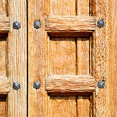 Image showing door    in italy old ancian wood and traditional  texture nail