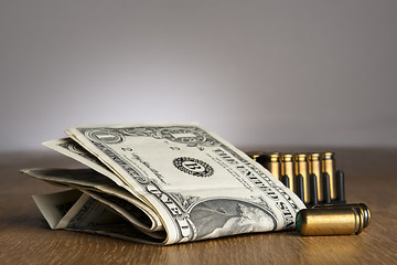 Image showing dollar bills with cartridges