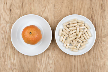 Image showing fruit and pills on table