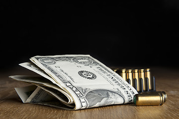 Image showing dollar bills with cartridges