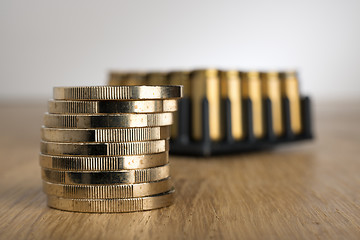 Image showing Euro Coins with gun cartridges