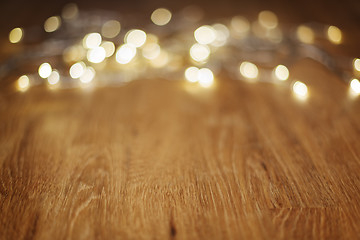 Image showing Wooden table with bokeh lights