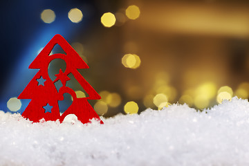 Image showing red tree on artificial snow with lights