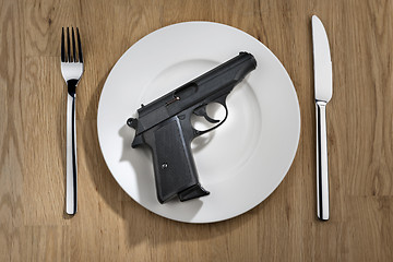 Image showing pistol on plate