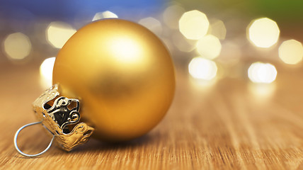 Image showing golden bauble with bokeh lights