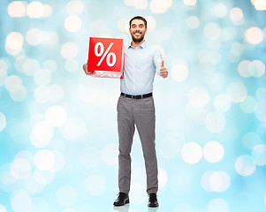 Image showing smiling man with red shopping bag