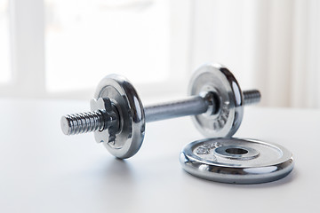 Image showing close up of iron dumbbell on table