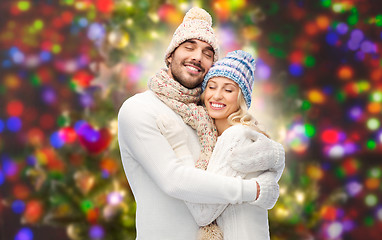 Image showing smiling couple in winter clothes hugging