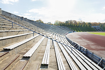 Image showing stands with rows of benches on stadium