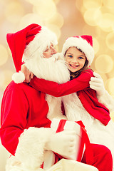 Image showing smiling little girl with santa claus