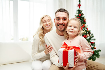 Image showing happy family at home with christmas gift box