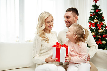 Image showing happy family at home with christmas gift box